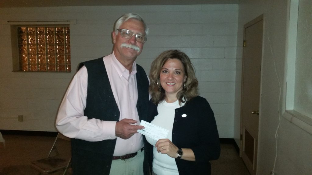 President Steve Marx presents KrisAnne Hall a check after her presentation on the Constitution and Bill of Rights at the May 3rd, 2016 Membership meeting.